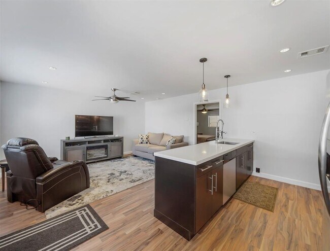 Updated flooring, lighting, and kitchen create a clean, polished feel. - 309 Stratford St