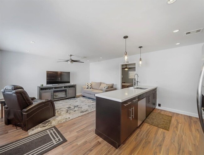 Updated flooring, lighting, and kitchen create a clean, polished feel. - 309 Stratford St