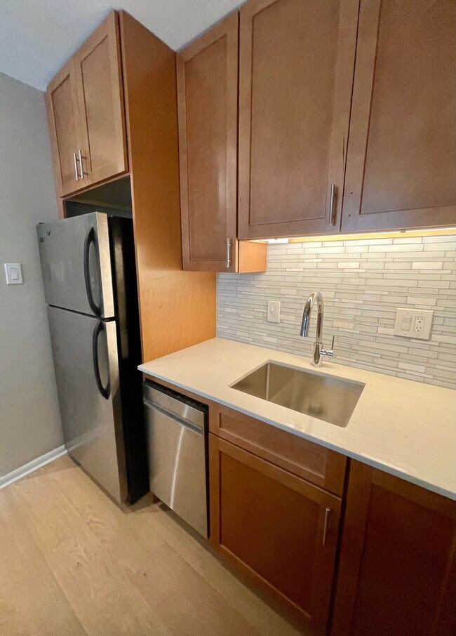 Granite countertops and glass tile backsplash - 1260 21st St NW