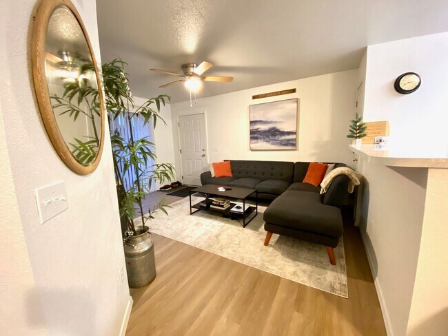 Living room with new luxury vinyl plank floor in 2020. - 135 Baker Street #102