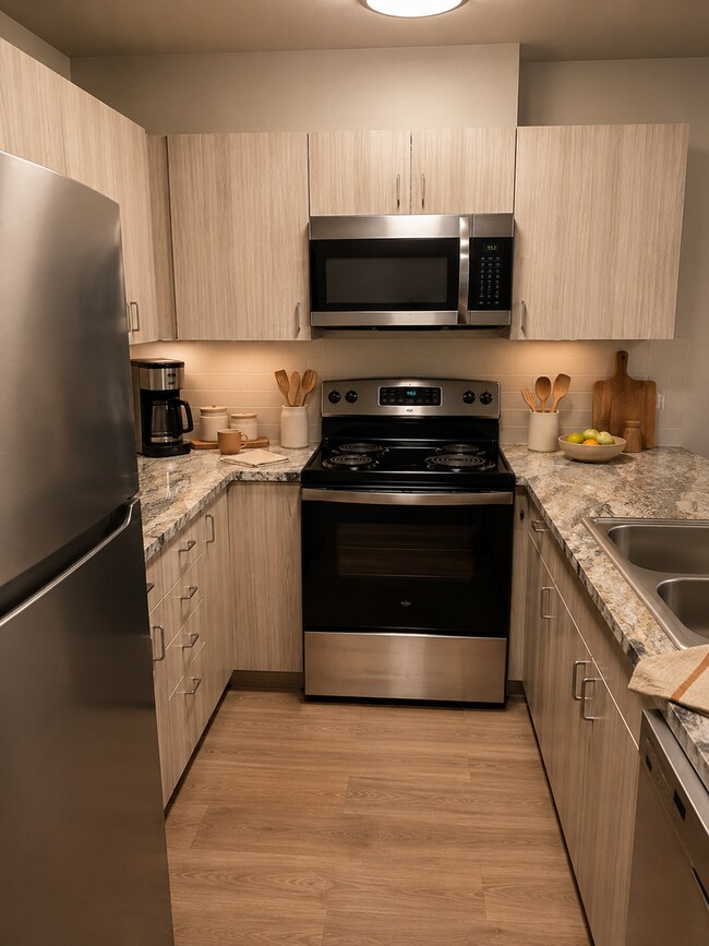 Foto del edificio - Open Layouts and Modern Finishes Await! From Stainless Steel Style To LVP Floors You'll Love!