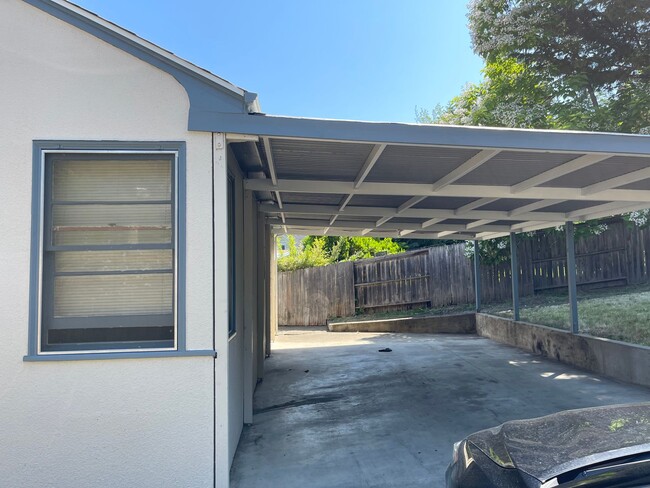 Building Photo - 2 bedroom house with a basement and carport