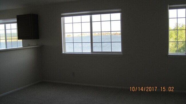 5 Living Room window lake views - 6850 Xavier Cir