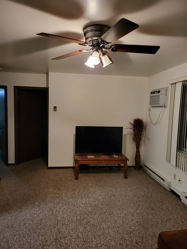 Living room, TV included with Rent - 2405 E 8th St