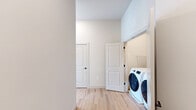 This contemporary apartment, located at 209–215 Durham Ave in Metuchen, NJ, offers 1230 square feet of thoughtfully designed living space. The single-story layout includes two bedrooms, three bathrooms, and an open-concept kitchen and living area. The primary bedroom is generously sized at 190 square feet, providing ample space for relaxation.

The interior is characterized by its modern aesthetic, featuring sleek lines and a neutral color palette. Hardwood floors run throughout, adding warmth and durability to the space. Large windows in every room flood the apartment with natural light, creating a bright and airy atmosphere.

The kitchen is a highlight, boasting white cabinetry contrasted with gray lower cabinets, stainless steel appliances, and a spacious island with a waterfall edge. Pendant lighting adds a touch of style while illuminating the workspace.

Bathrooms are designed with functionality and style in mind, featuring glass-enclosed showers, modern fixtures, and ample storage space. The apartment also includes two closets for additional storage.

The open floor plan encourages a seamless flow between living spaces, making it ideal for both everyday living and entertaining. With its combination of modern design, practical amenities, and prime location, this apartment offers a desirable urban living experience.
