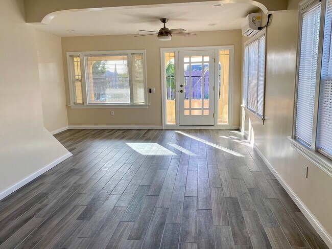 Living room and balcony - 1610 La Fayette Rd