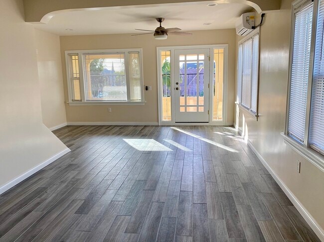 Living room and balcony - 1610 La Fayette Rd