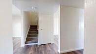 This two-story home in Sacramento, California offers an impressive seven bedrooms and two full bathrooms spread across two well-proportioned floors. The layout is designed to maximize functionality, with each floor offering a comparable footprint connected by a carpeted staircase.

The main level features rich, dark hardwood-style flooring that flows through the hallways and common areas, lending a warm and cohesive feel. The kitchen is equipped with warm wood-toned cabinetry, a white gas range, and ample counter space, with a large window that invites natural light and provides views of the surroundings.

The bedrooms are carpeted throughout, offering a comfortable and quiet atmosphere. Several rooms include sliding-door closets with built-in hanging rods, providing generous storage. The primary bedroom offers a notably spacious feel with clean white walls and easy access to the hallway. Additional bedrooms maintain a consistent, bright aesthetic with neutral tones and multiple electrical outlets.

Both bathrooms are identically appointed with tile flooring, a full tub-shower combination, a wall-mounted sink, toilet, and overhead wood-toned cabinetry for storage. The clean, straightforward design keeps these spaces highly functional.

Overall, the home presents a practical and spacious layout well-suited for large households, with consistent finishes, abundant natural light, and a clean, move-in-ready condition throughout.