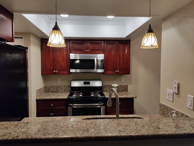 Open kitchen with Breakfast counter - 9428 Twin Trails Dr