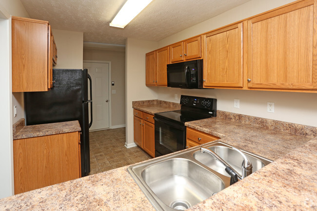 01 2BR, 1.5BA - 1,000 SF - Townhome With Garage - Kitchen - Upper and Lower Stone Apartments