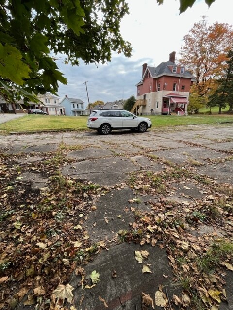 Exterior, with huge yard and parking pad. - 433 Herschel St