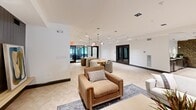 Located at 160 Simsbury Road in West Hartford, CT, this thoughtfully designed single-floor community amenity space offers a diverse range of gathering areas within a generous, open footprint. The layout flows seamlessly between distinct functional zones, creating an inviting environment suited for both social and relaxed settings.

The central lounge area serves as the heart of the space, anchored by a fireplace set against a dramatic dark wood accent wall. Comfortable seating arrangements, warm pendant lighting, wall sconces, and curated décor including artwork and potted plants contribute to a refined yet approachable ambiance. Light-toned herringbone-patterned flooring runs throughout, adding visual texture and continuity.

Adjacent to the lounge, a spacious game room houses a full-size pool table with a bold blue felt surface, illuminated by stylish track and pendant lighting. High-top seating is positioned nearby, and glass-paneled doors connect this area to the rest of the space, maintaining an open and airy feel.

The wet bar area is appointed with dark cabinetry, black granite countertops, and gold-toned fixtures, complemented by a striking geometric-patterned accent wall and a wall-mounted television. A private dining nook features built-in bench seating, a natural wood table, and the same bold wallcovering as an accent backdrop. A flexible open area with round table seating rounds out the space, ideal for casual gatherings or events.