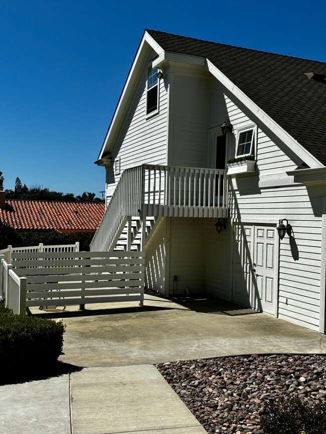 Patio, entry & access to laundry below - 649 Crest Dr