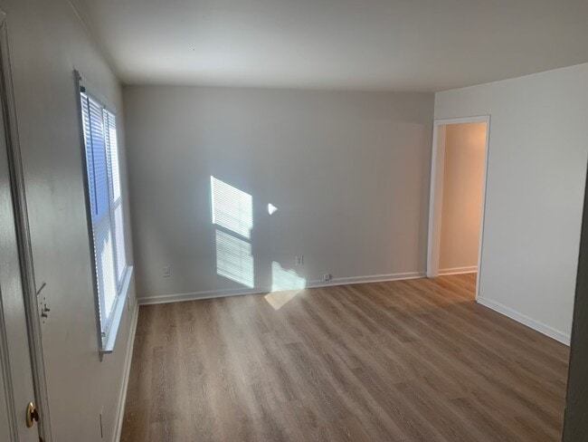 Living room with LVP flooring - 4569 Ayers Rd