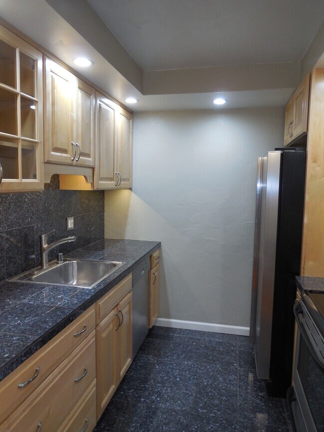 kitchen w/ stainless steel appliances - 3431 Park Blvd