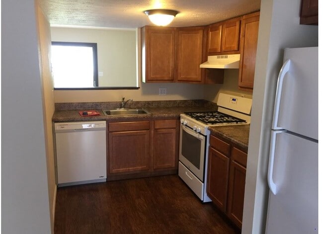 Older townhome kitchen - Evergreen Apartments