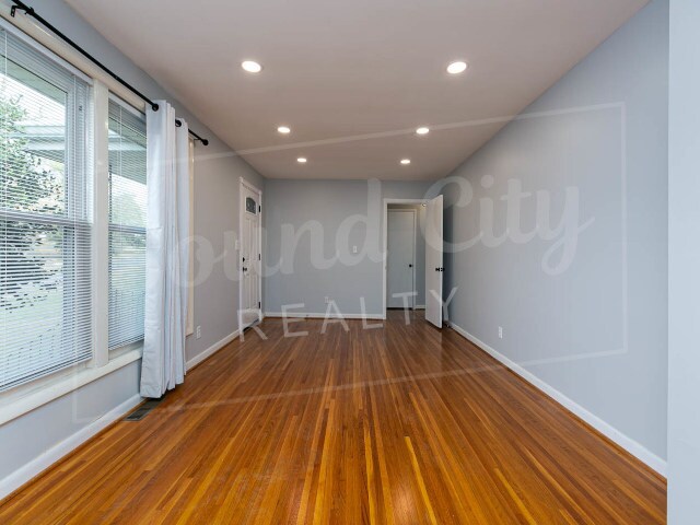 Living Room and front door on left - 2620 Pleasant Green Rd