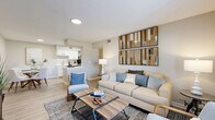 Located at 2880 North Wickham Road in Melbourne, Florida, this one-bedroom, one-bathroom residence offers a comfortable and efficiently designed single-floor layout. The open-concept living and kitchen area serves as the heart of the home, featuring light wood-look flooring, neutral walls, and a bright, welcoming atmosphere. The living space accommodates a generous seating arrangement and is accented by stylish wall décor, with a front-facing window that brings in natural light.

The kitchen is well-equipped with crisp white shaker cabinetry, white quartz countertops, a subway tile backsplash, black appliances including a refrigerator, electric range, and dishwasher, and a stainless steel sink. A pantry provides additional storage convenience.

The bedroom is a comfortable retreat finished with plush carpeting, a ceiling fan, and a window with outdoor views. Two closets offer ample storage. The full bathroom features a tub-shower combination, wood-look tile flooring, and clean white fixtures.

A hallway connects the spaces efficiently, contributing to the home's smart, functional flow. The overall aesthetic is modern and cohesive, blending light tones with warm accents throughout.