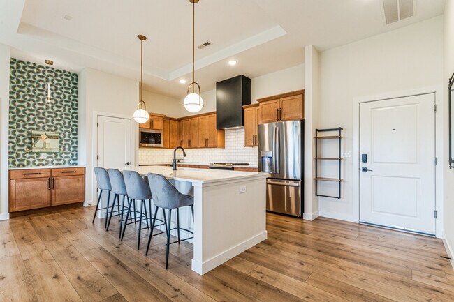 Open kitchen with upgraded lighting and appliances - 1953 1st Ave SE