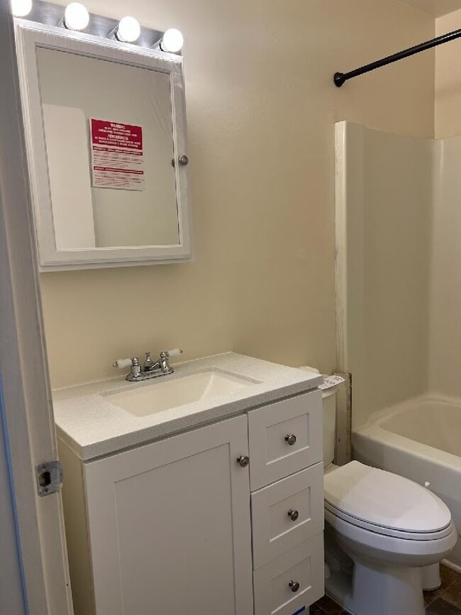new bathroom vanity, toilet - 2634 N Charles St Apartments