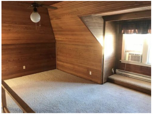 Wood paneled walls & ceiling fan - 801 S Main St