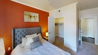 Located at 4101 Innovator Dr in Sacramento, California, this well-appointed single-floor residence offers a thoughtfully designed layout with a contemporary aesthetic throughout. The open-concept living area serves as the heart of the home, featuring rich hardwood-style flooring, crown molding, and neutral taupe accent walls that create a warm, modern atmosphere. Large windows flood the space with natural light, seamlessly connecting the living room to a dedicated dining area. The kitchen is outfitted with dark espresso cabinetry, granite-style countertops, a tile backsplash, and a full suite of stainless steel appliances, including a refrigerator, range, and built-in microwave. The space includes two bedrooms, each with plush carpeting, crown molding, and generous closet space. One bedroom features a bold terracotta accent wall and a walk-in closet, while the other includes direct access to a private outdoor patio. Two bathrooms are finished with dark vanity cabinetry, granite countertops, and tub-shower combinations. A dedicated in-unit laundry area with a full-size washer and dryer adds everyday convenience. Crown molding and consistent finishes throughout tie the space together into a cohesive, move-in-ready home.