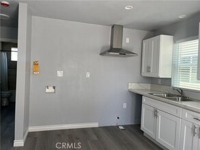 Building Photo - 1215 1/2-1212 W 104th St