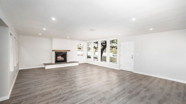 Living area with fireplace looking out to the canal - 3801 Esplanade