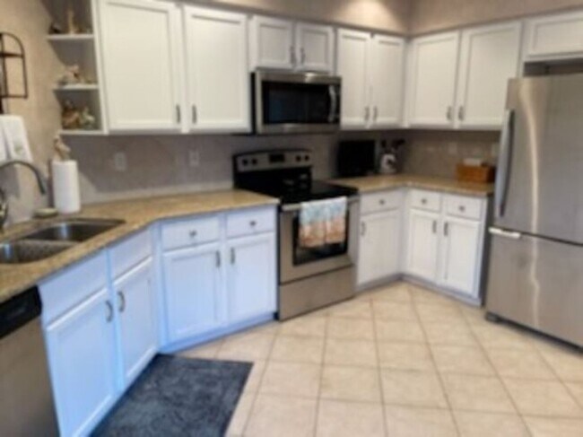 Building Photo - Gorgeous Golf Village Condo with Huge Lanai