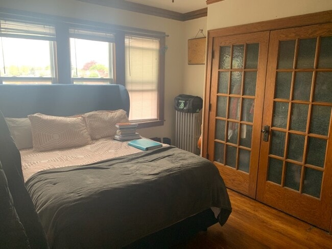 Main Room with charming french door closet - 3237 Lockwood N Ave