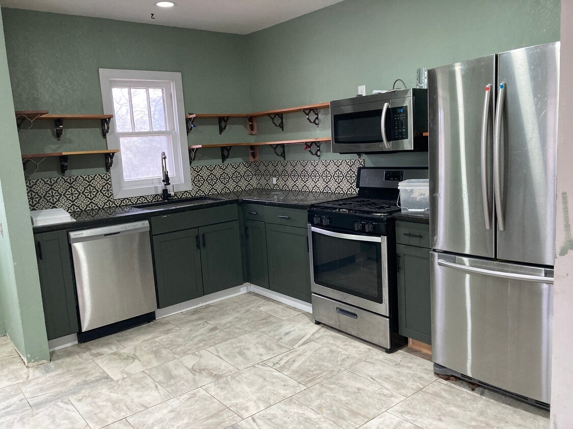 Kitchen, With Appliances, Gas Stove Granite Kitchen Countertops, beautiful cedar shelves, - 1503 N Broadway Ave