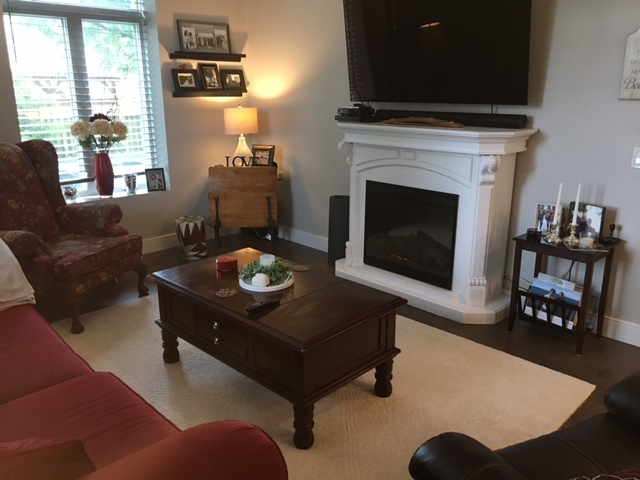 Living rm with firepalce and 65" flat screen TV - 135 Orr St