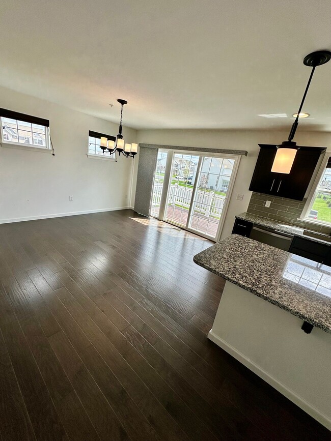 Kitchen / Dining Room looking out of slider to deck - 1618 Haralson Dr