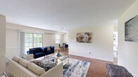 Located at 9071 Mill Creek Rd in Levittown, PA, this 2-bedroom, 1-bathroom home offers a comfortable and functional single-floor layout. The open living and dining area is bright and welcoming, featuring warm hardwood flooring, neutral-toned walls, and large sliding glass doors that flood the space with natural light and provide direct access to a white-railed deck overlooking lush, tree-lined grounds. The kitchen is well-equipped with rich cherry wood cabinetry, stainless steel appliances including a refrigerator, range, microwave, and dishwasher, complemented by a white tile backsplash and hardwood floors. Both bedrooms are carpeted and offer a calm, restful atmosphere, with the generously sized primary bedroom featuring ample natural light from multiple windows and access to one of the home's five closets. The full bathroom is clean and neatly finished with tile flooring, a shower/tub combination, and wall-mounted shelving. A hallway and staircase connect the living areas efficiently. The outdoor deck provides serene views of the surrounding greenery and open landscape, enhancing the overall appeal of this charming Levittown residence.