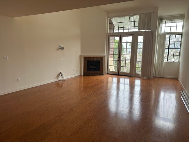 Spacious Living Room - Lots of natural light with high ceilings and entertainment wiring built into - 1837 Midvale Ave