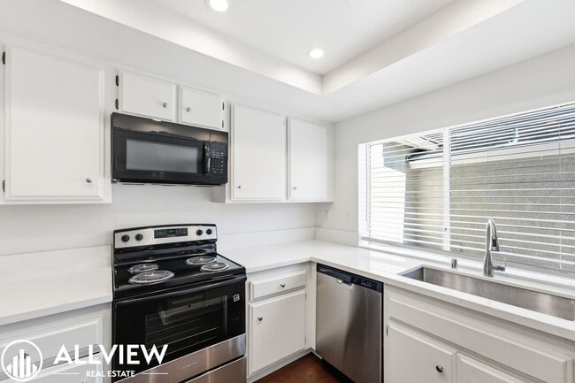 Building Photo - Fully Renovated 2 Bed Townhome with Private Patio, 2-Car Garage & Community Pool