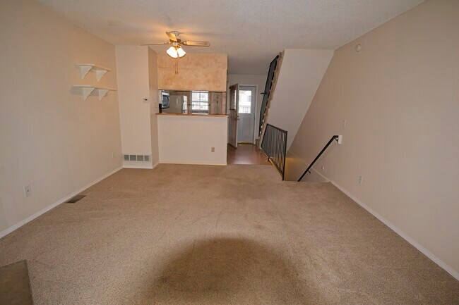 Living room facing kitchen - 9545 W Coal Mine Ave