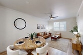 Located at 4111 N Drinkwater Blvd in Scottsdale, Arizona, this single-story, one-bedroom, one-bathroom residence offers a thoughtfully designed open-concept layout with clean, modern finishes throughout. Light wood-style flooring flows seamlessly across the entire space, complemented by crisp white walls and crown molding that lend a polished, cohesive aesthetic.

The combined kitchen and living area forms the heart of the home. The kitchen features a white peninsula with a quartz countertop, undermount sink, white shaker cabinetry, stainless steel appliances, and stylish pendant lighting overhead. A galley-style layout provides ample counter and storage space. The dining area sits adjacent to the kitchen, while the living room benefits from large windows that invite abundant natural light and a ceiling fan for year-round comfort.

The bedroom is a serene retreat, offering a comfortable footprint, a ceiling fan, a window with natural light, and multiple closets for generous storage. The full bathroom is clean and functional, featuring white cabinetry with quartz countertops, a tub-shower combination, and wood-style flooring that ties the space together.

A hallway connects the private areas of the home, and built-in shelving near the entryway adds a practical decorative touch. The overall ambiance is bright, modern, and inviting — ideal for comfortable Scottsdale living.