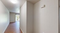 Located at 700 Kincheloe Ct in Woodland, CA, this 3-bedroom, 2-bathroom residence offers a practical and comfortable single-floor layout. The open living room features warm wood-style laminate flooring and a sliding glass door that invites natural light and provides outdoor access. The kitchen is well-equipped with light wood cabinetry, white appliances including a gas range and refrigerator, a double sink, and ample counter space. A window above the dining area brings in additional natural light. The three bedrooms are finished with plush carpet and feature windows with views of surrounding greenery. Each bedroom includes a closet—some with sliding doors—offering generous storage. The primary bedroom provides a comfortable and functional retreat. The two bathrooms are finished with wood-style flooring and include vanities with light cabinetry. One bathroom features a tub and shower combination, while the other offers a streamlined layout with a single vanity and toilet. A hallway connects the private spaces efficiently. Throughout, the unit maintains a clean, neutral palette with white walls and light trim, creating a bright and move-in ready environment suited for a variety of living arrangements.