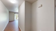 Located at 700 Kincheloe Ct in Woodland, CA, this 3-bedroom, 2-bathroom residence offers a practical and comfortable single-floor layout. The open living room features warm wood-style laminate flooring and a sliding glass door that invites natural light and provides outdoor access. The kitchen is well-equipped with light wood cabinetry, white appliances including a gas range and refrigerator, a double sink, and ample counter space. A window above the dining area brings in additional natural light. The three bedrooms are finished with plush carpet and feature windows with views of surrounding greenery. Each bedroom includes a closet—some with sliding doors—offering generous storage. The primary bedroom provides a comfortable and functional retreat. The two bathrooms are finished with wood-style flooring and include vanities with light cabinetry. One bathroom features a tub and shower combination, while the other offers a streamlined layout with a single vanity and toilet. A hallway connects the private spaces efficiently. Throughout, the unit maintains a clean, neutral palette with white walls and light trim, creating a bright and move-in ready environment suited for a variety of living arrangements.