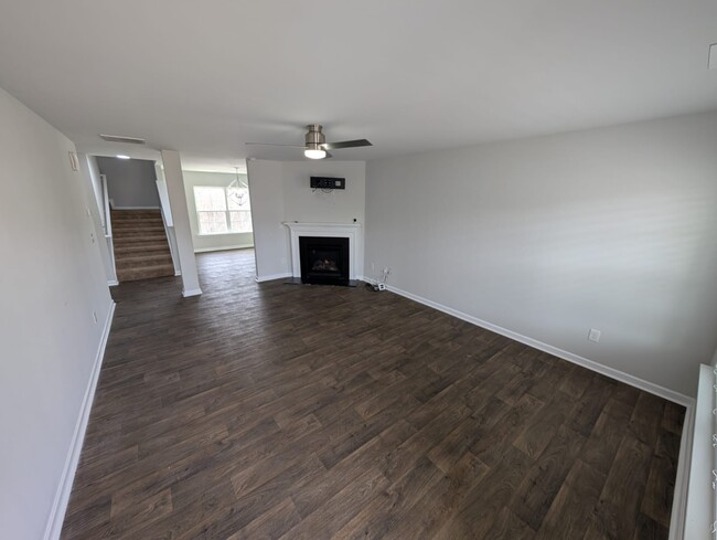 Living room with sealing fan included. - 1682 Weatherend Dr