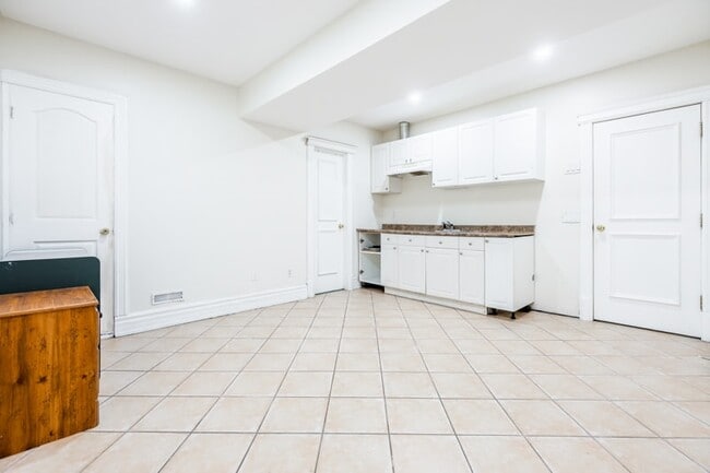 Building Photo - Bright, Beatutiful & Look Out Basement Apt.
