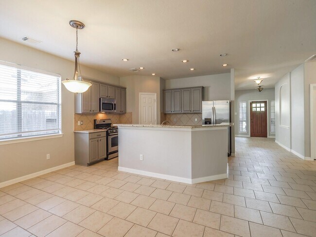 Foto del edificio - 5511 Wild Milberry Dr