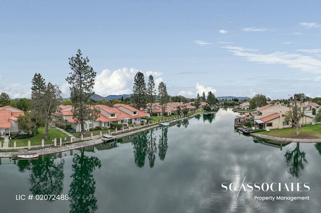 Building Photo - Adorable WATERFRONT Gated Lakeside Villas ...
