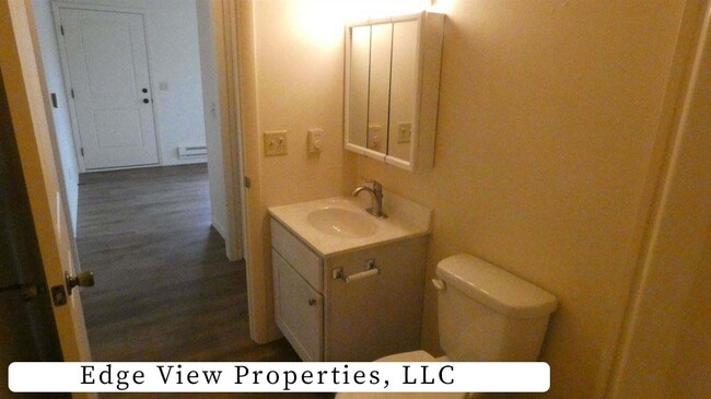 Bathroom- photos of opposite unit. However, this unit has similar finishes & mirror image floor plan - 500 S Darst St