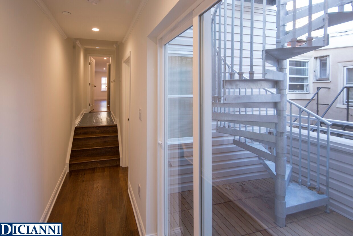 hallway between master and second bedroom with outdoor space in between - 1624 Pine St