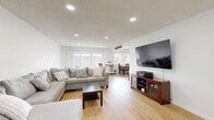 Located at 1100 W Huntington Dr in Arcadia, CA, this well-appointed single-story home offers 2 bedrooms, 3 bathrooms, a family room, living room, dining room, and a dedicated laundry area. Light wood flooring flows throughout, creating a cohesive and bright interior. The open-concept living and dining area is generously proportioned, featuring recessed lighting, large windows with vertical blinds that invite natural light, and a ceiling fan in the dining space. The kitchen showcases white cabinetry, granite-look countertops, and stainless steel appliances, including a French door refrigerator, complemented by clean flush-mount lighting. The primary bedroom offers a comfortable layout with ample closet access across the home's five closets. The second bedroom features light blue accent walls and warm wood flooring. The bathrooms are finished with crisp white cabinetry, modern black hardware, and light wood-toned floors. A conveniently tucked stacked washer and dryer unit serves the in-unit laundry area. The family room provides additional flexible living space. Overall, the home presents a clean, functional, and welcoming ambiance well-suited to everyday living in the heart of Arcadia.