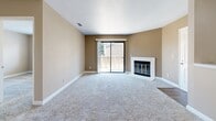 This 1-bedroom, 1-bathroom residence in Arden-Arcade, California offers a practical and well-organized single-floor layout. The combined living, dining, and kitchen area forms the heart of the home, with warm beige walls, plush carpeting in the living space, and durable wood-look vinyl flooring extending into the kitchen and dining areas. A ceiling fan adds comfort and airflow to the living room, while a sliding glass door floods the space with natural light and opens directly onto a private wooden balcony with views of surrounding trees and the neighborhood.

The kitchen is efficiently designed with warm oak cabinetry, ample upper and lower storage, speckled countertops, a double-basin sink, and black appliances including a refrigerator, range, and dishwasher. A peninsula counter provides a natural separation between the kitchen and the open living and dining areas.

The bedroom is a comfortable, carpeted retreat featuring a large window with outdoor views and a sliding-door closet for convenient storage. Two additional closets elsewhere in the unit provide generous storage throughout. The bathroom is clean and straightforward, with a full tub-shower combo, wood-look vinyl flooring, and a wall-mounted mirror. A hallway connects the key living spaces, completing this efficiently designed and move-in-ready home.