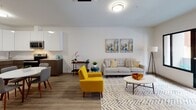 This contemporary 1-bedroom, 1-bathroom residence at 125 S Harrison in East Orange, NJ offers a thoughtfully designed open-concept layout finished with modern materials throughout. Light wood-tone flooring flows seamlessly across the entire unit, creating a cohesive and airy feel.

The living area is bright and welcoming, anchored by large sliding glass doors that open onto a private balcony with views of the surrounding neighborhood, allowing abundant natural light to fill the space. The kitchen is well-appointed with high-gloss white upper cabinetry, warm wood-toned lower cabinets, stone-look countertops, a classic subway tile backsplash, and a full suite of stainless steel appliances including a refrigerator, range, microwave, and dishwasher.

The bedroom is a calm, neutral retreat featuring a generous window with urban views, a built-in closet, and a ceiling-mounted climate control unit. Clean white walls and understated finishes lend a serene atmosphere.

The bathroom is clean and modern, outfitted with wood-look flooring, a sleek floating vanity with a mirrored medicine cabinet, and crisp white walls that enhance the sense of brightness and space. Every detail of this residence reflects a contemporary aesthetic suited for comfortable urban living.