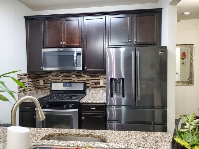 kitchen view 2 with all stainless steel appliances - 737 Strassle Way